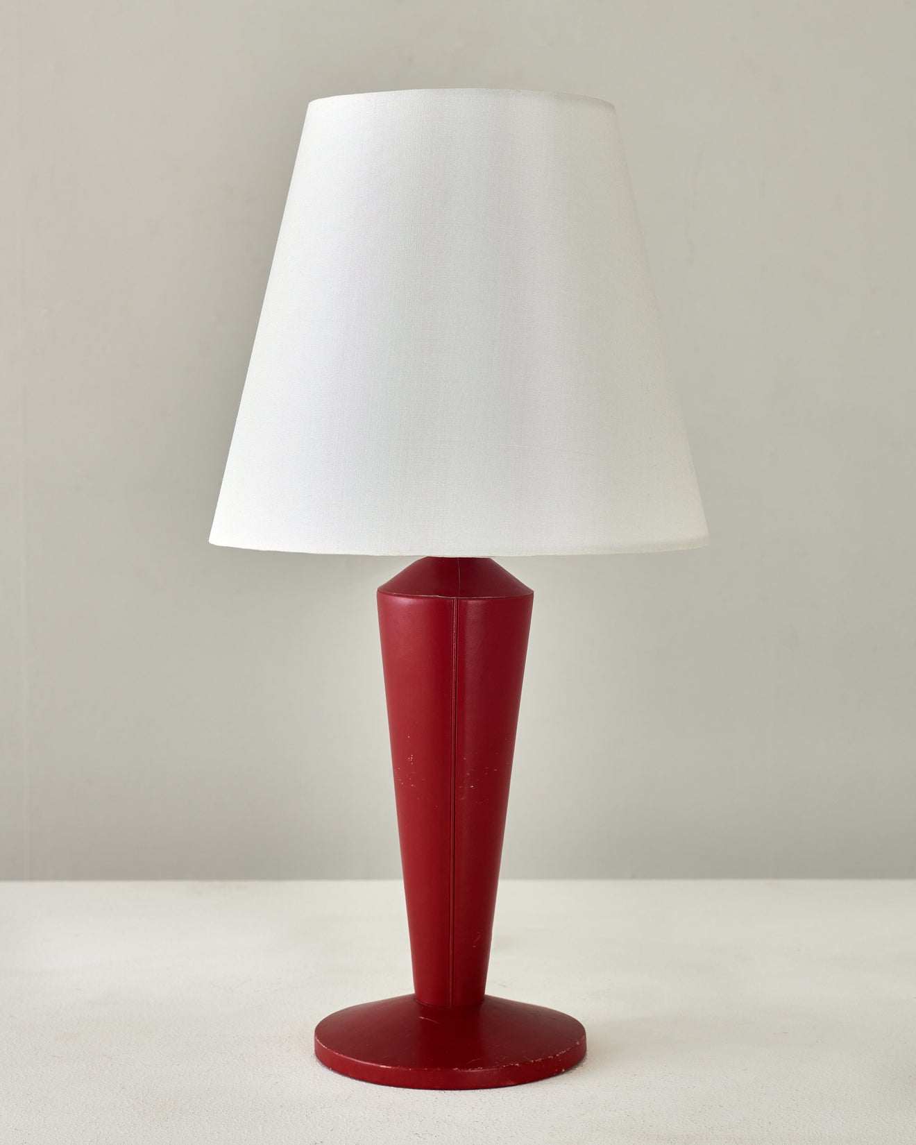 LEATHER TABLE LAMP IN THE STYLE OF ADNET